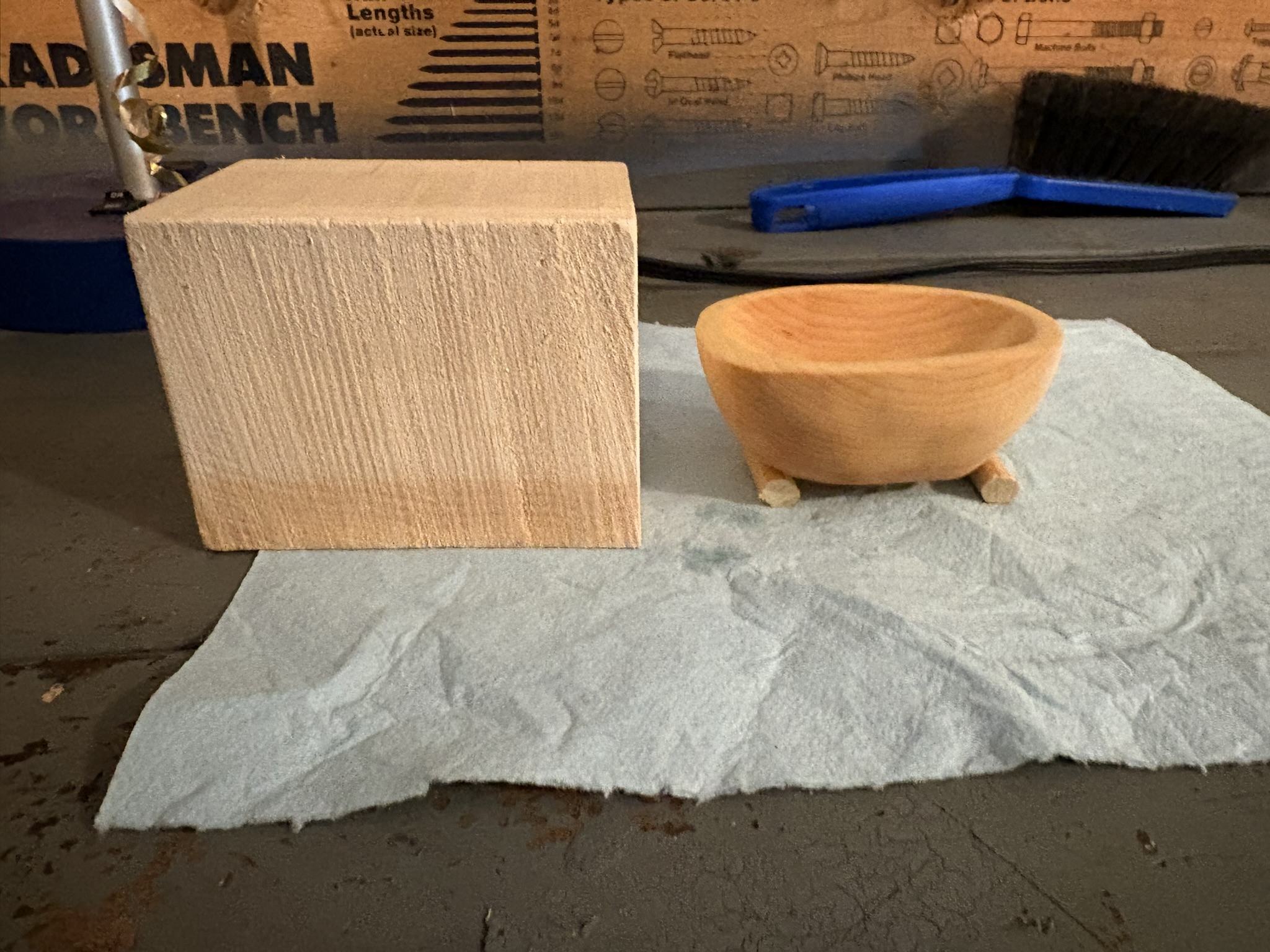 The original basswood blank beside the finished bowl.
